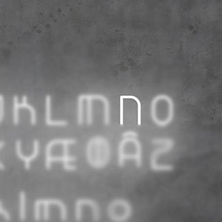 Настенный светильник Artemide Alphabet 1201N00A Настенный светильник Artemide Alphabet 1201N00A